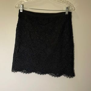 DKNY black lace short skirt. Side zipper